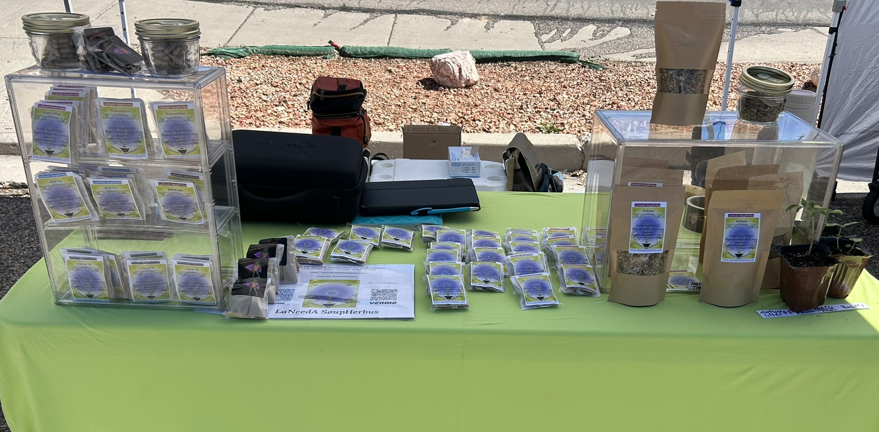 SøupHerbuSeedz market table with herbal products and seed packets