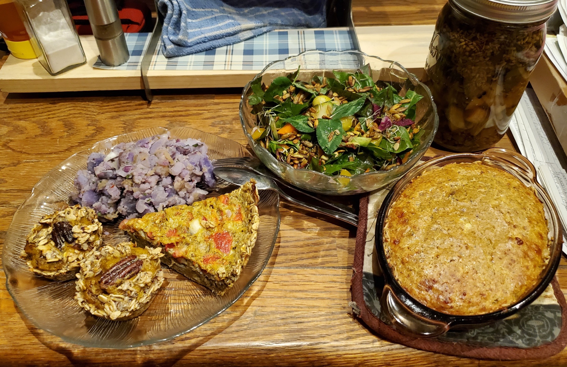 Plated whole-food meal with salad, mash, and baked dish